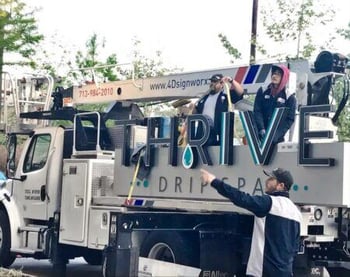 Houston sign company installing new outdoor sign