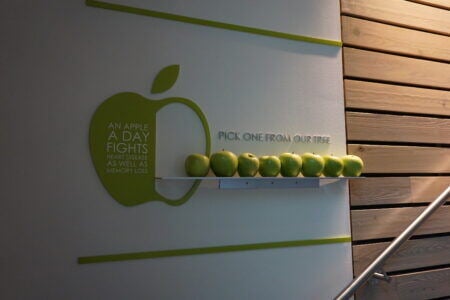 Creative Houston wall signs with apples to promote health